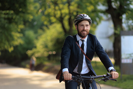 Enjoyed manager wearing suit commuting to work in early morning.