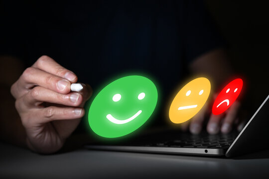 businessman rating evaluate happy and execellent performance vote with green smile face icon for customer service by online score with computer technology background