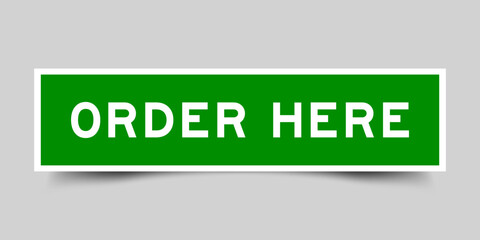 Green color square label sticker with word order here on gray background