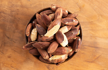 Bowl of Pili Nuts from the Philippines on a Wooden Table