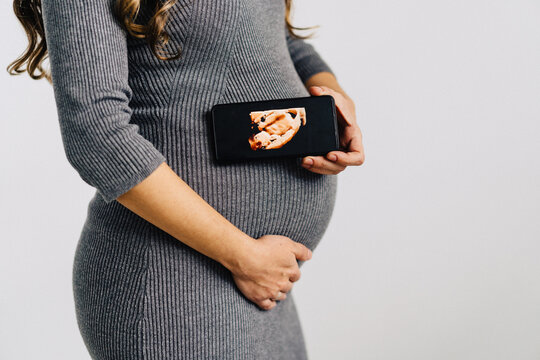 Anonymous pregnant woman with fetus photo
