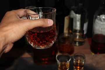 red strong alcohol drinks, spirits and distillates iset in glasses