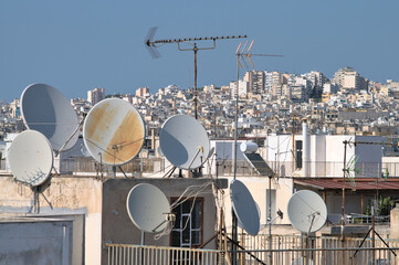 TV antennas on the roofs of houses in Athens - Greece.