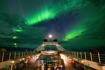 Northern lights over a expedition ship in Alaska    