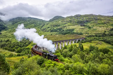 Papier Peint photo Viaduc de Glenfinnan Glenfinnan railway viaduct in Scotland with the Jacobite steam train passing by