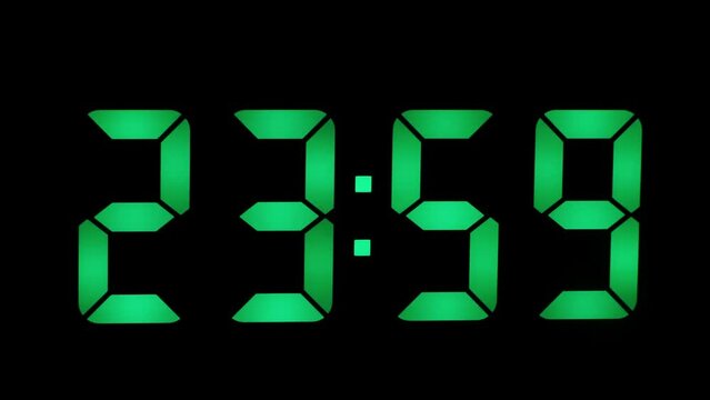 Green digits on digital LED clock counts down the last seconds of the outgoing day or year, time 23-59, new year or new day concept