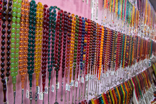 Selectively focused on the Prayer beads in different colors. Close-up pictures of tesbih in Turkey. View of tesbih - tespih hanging in the street shop in Kemeralti - Izmir - Turkey