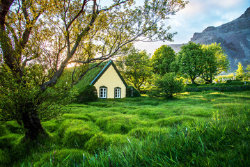 Magical charming beautiful landscape with turf roof church in old Iceland traditional style and mystical cemetery in Hof, Skaftafell, Vatnajokull National Park. Exotic countries. Amazing places.