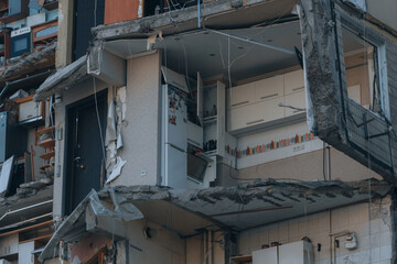 Fototapeta na wymiar Impact on a high-rise building in the city of Dnipro, Ukraine. A residential building destroyed by an explosion after a Russian missile attack. Consequences of the explosion.