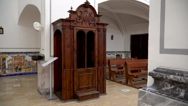 Wooden confessional inside a Christian church.