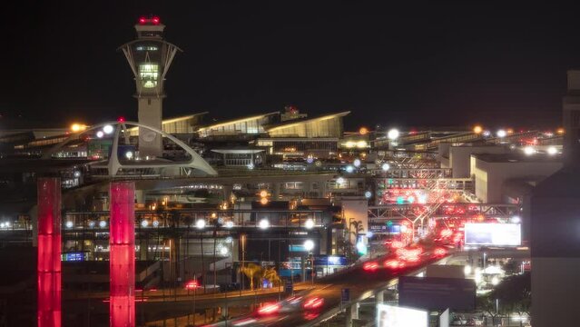 Generic Los Angeles LAX International Airport Night Timelapse of Departures and Arrivals with Busy Vehicle Traffic Lights on Driving Cars during a Dreamy California Night