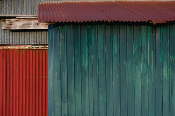 Old rusty zinc fence wall surface grunge, vintage style metal sheet roof for texture and background in retro concept