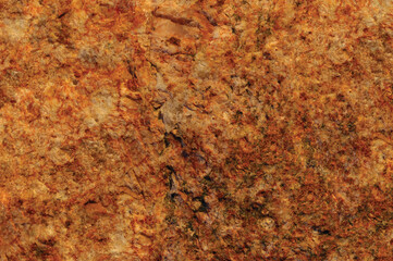 Raw pegmatite feldspar igneous rock terracotta pattern, rusty orange red golden amber yellow horizontal background, coarse light crystals  texture large detailed bright textured minerals macro closeup
