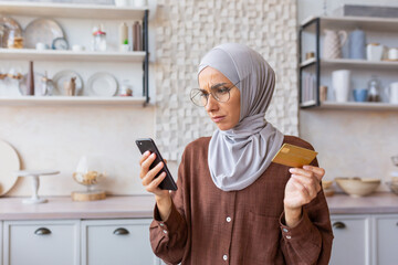 Upset and deceived woman at home received an error and wrong code, Muslim woman in hijab trying to...