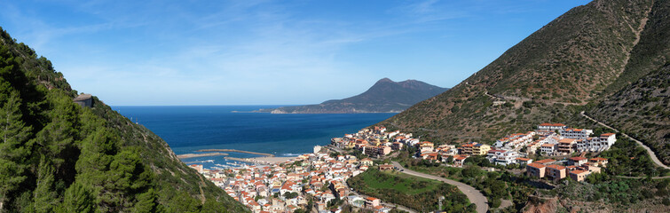 Fototapeta na wymiar Town on the sea coast, Buggerru, Sardinia, Italy. Sunny Fall Season Day. Panorama