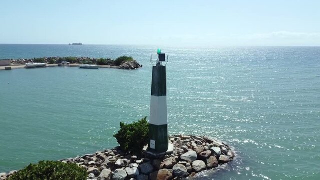 Nueva esparta bayside beach lighthouse, margarita island, venezuela. Sunny day in the beautiful caribbean sea, atlantic ocean.