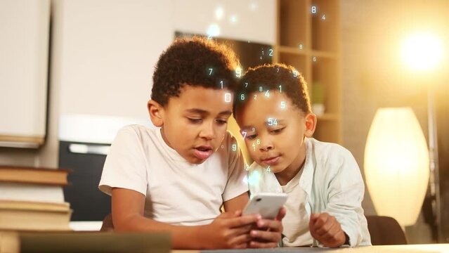 Cute african american little boys brothers hold smartphone scrolling social media app application gadget at home Visualisation of information numbers flying from mobile phone Network concept