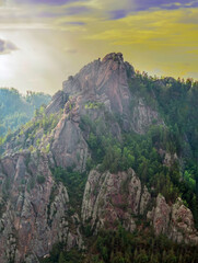 High forest rocks for advanced hiking and alpinism at the sunset.