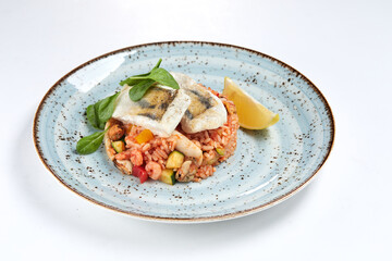 white fish with rice and vegetables
