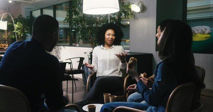 African American woman enjoys telling stories to friends