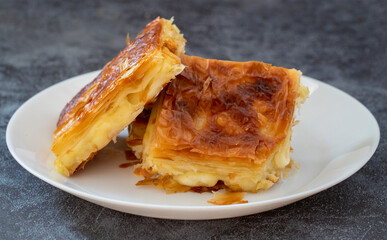 Turkish traditional pastry with cheese. Oven fried, delicious sliced cheese pastry.