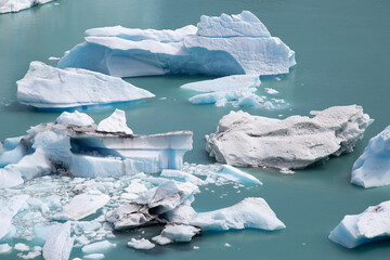 Icebergs and chunks of ice floating in a lake