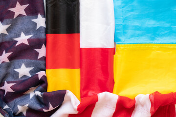 Flags of Germany and Ukraine and Poland and the USA as a background, association and union