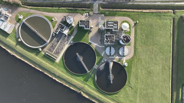 Water filtration installation a process of purifying water using various techniques, systems and equipment to remove impurities and improve water quality. Aerial.