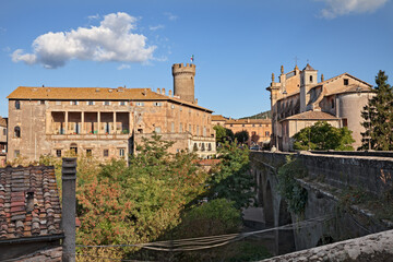 Fototapeta na wymiar Bagnaia, Viterbo, Lazio, Italy: cityscape of the medieval village with the ancient Ducal Palace anf the old church San Giovanni Battista