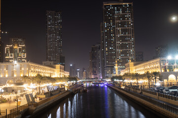Sharjah urban cityscape skyline night scene., Alqasba canal in Sharjah, United Arab Emirates
