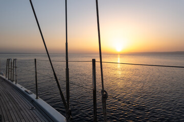 Fototapeta na wymiar Railing and struts of sailing yacht at sunset