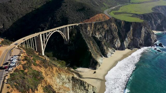 Aerial view of vehicles driving on Bixby Creek Bridge on highway one, California, United States.