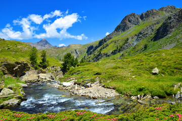 Fototapeta na wymiar Gran Paradiso National Park. Aosta Valley, Italy. Beautiful mountain landscape in sunny day.
