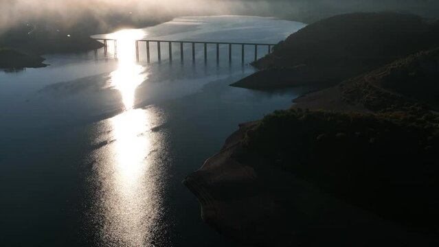 Aerial view of Pantano de Riano bridge at Embalse de Riano lake, Spain.