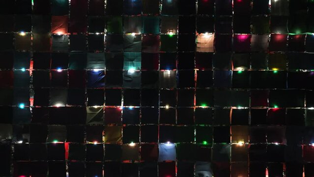 Aerial view of local market colourful tents at Minar Moshjid Tabling for the Global Muslims Congregation at night in Tongi, Dhaka, Bangladesh.