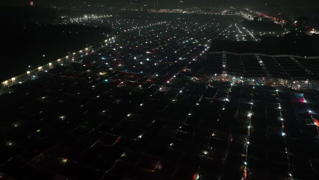 Aerial view of local market colourful tents at Minar Moshjid Tabling for the Global Muslims Congregation at night in Tongi, Dhaka, Bangladesh.