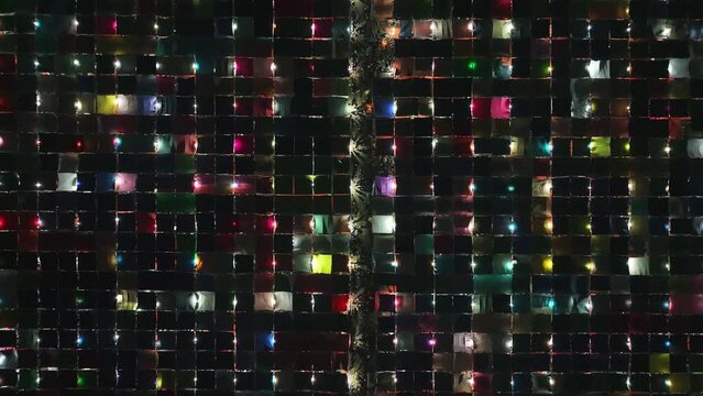 Aerial view of local market colourful tents at Minar Moshjid Tabling for the Global Muslims Congregation at night in Tongi, Dhaka, Bangladesh.