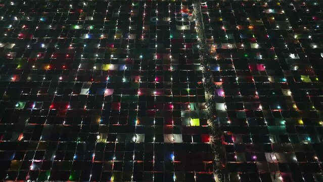 Aerial view of local market colourful tents at Minar Moshjid Tabling for the Global Muslims Congregation at night in Tongi, Dhaka, Bangladesh.