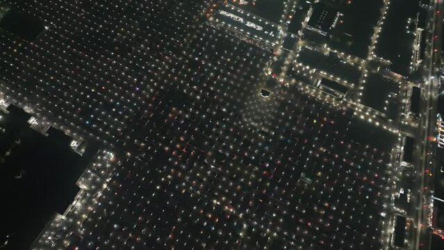 Aerial view of local market colourful tents at Minar Moshjid Tabling for the Global Muslims Congregation at night in Tongi, Dhaka, Bangladesh.