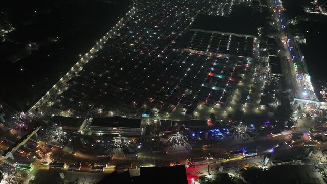 Aerial view of local market colourful tents at Minar Moshjid Tabling for the Global Muslims Congregation at night in Tongi, Dhaka, Bangladesh.
