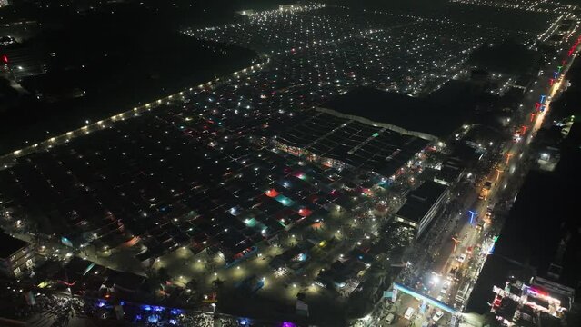 Aerial view of local market colourful tents at Minar Moshjid Tabling for the Global Muslims Congregation at night in Tongi, Dhaka, Bangladesh.