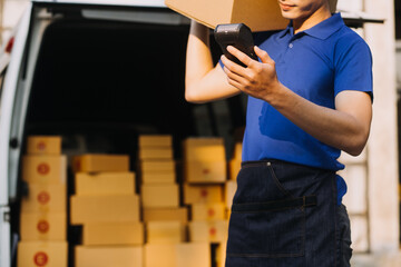 Obraz premium Entrepreneurs Small Business SME Independent men work at home Use smartphones and laptops for commercial checking, online marketing, packing boxes, SME sellers, concept, e-commerce team, online sales