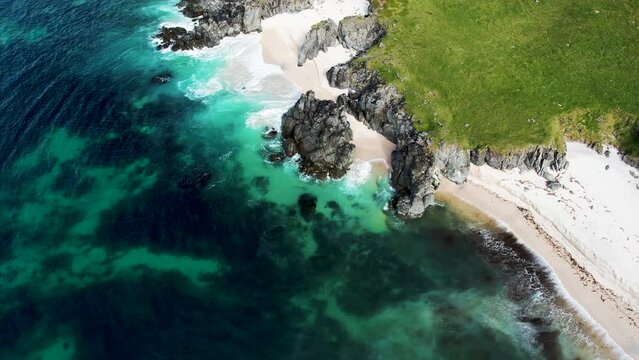 Aerial view of wild rocky cliffs along the coastline in Iceland southern region.