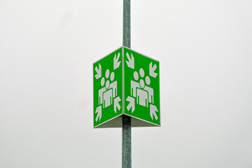 Meeting or gathering place sign on a very light sky background