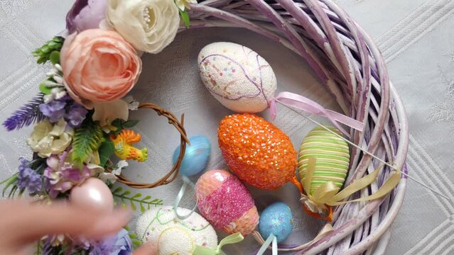 Eggs are placed in the middle of the festively decorated wreath. Easter celebration.