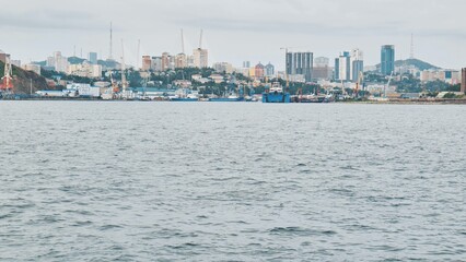 Panorama of the Russian city of Vladivstok. View from the moving ferry.