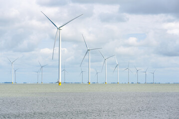 View of an offshore wind farm on a cloudy day