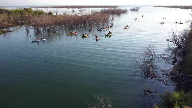 Sea of Galilee, Israel - 4 November 2022: Aerial view of people kayaking in a lake.