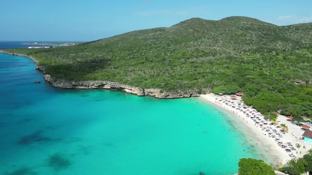 Aerial drone footage over Grote Knip in West Punt Curaca. Carribean beach drop down footage over the clear sea and sand