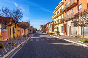 Fototapeta na wymiar Street Road in a small country town, Sindia, Sardinia, Italy. Sunny Fall Season Day.